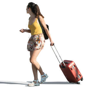 woman walking with a backpack and a suitcase