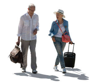 cut out backlit elderly man and woman with travel bags walking