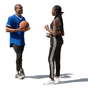 man and woman talking at a basketball court