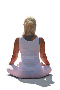 woman doing yoga outside in the sun