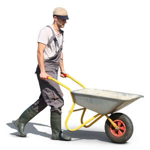 man pushing a wheel-barrow