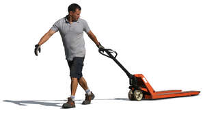 man pulling a hand pallet truck