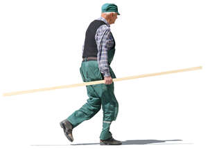 elderly man carrying a wooden board