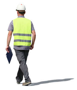 worker with helmet walking in sulight