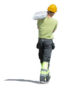 workman carrying a heavey bag