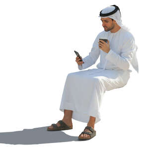 arab man sitting and drinking coffee