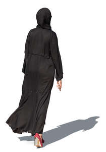 muslim woman in a black abaya walking