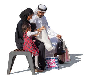 arab family with shopping bags sitting and talking