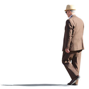 older man in a brown suit walking