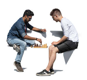 two cut out men playing chess outside on a bench