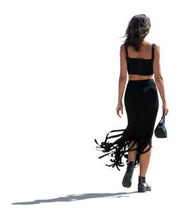 cut out backlit woman in a black summer dress walking 