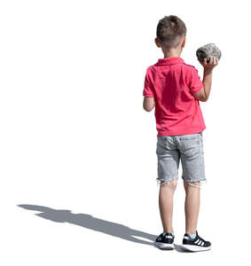 cut out boy standing and holding a rock