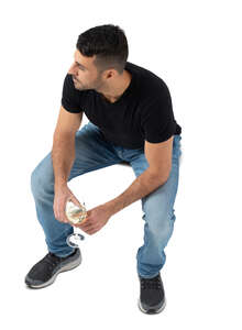 top view of a man sitting and drinking wine