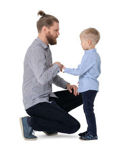 cut out man squatting and talking to his son