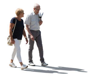 two cut out backlit elderly people walking