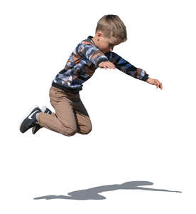 cut out boy jumping outside