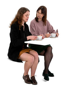 two cut out women drinking coffee and talking