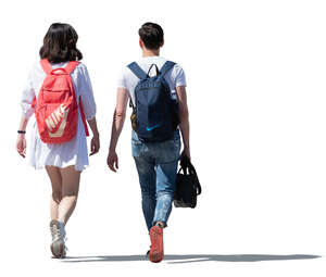 two sidelit people walking