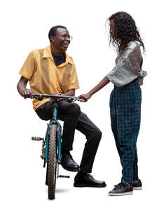 cut out man sitting on a bike talking to a woman