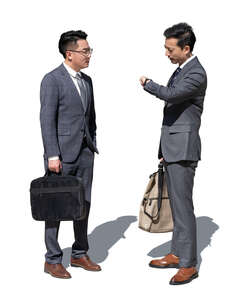 two cut out asian businessmen standing and talking
