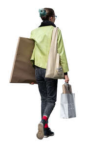 cut out woman carrying a large package under her arm walking