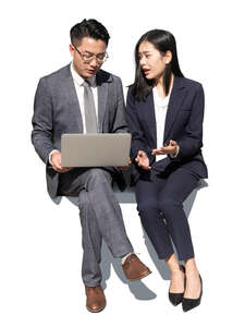 cut out asian businesswoman and businessman sitting and talking
