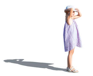 cut out little girl in a summer dress standing and looking