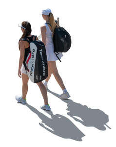 two cut out backlit tennis players walking seen from above