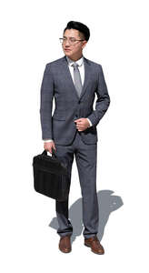 cut out asian man in a suit standing outside