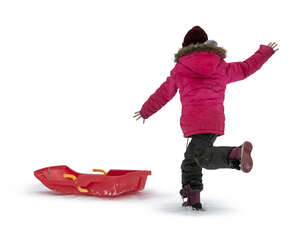 cut out girl with a sledge gaving fun in the snow