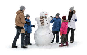 cut out kids and adults building snowman in winter