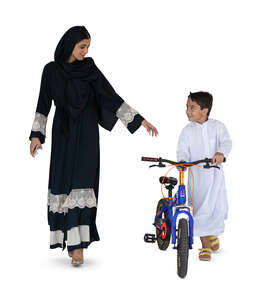 cut out arab boy with a bicycle walking with his mother