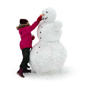 cut out little girl making a snowman