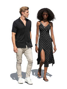 two cut out people walking on the street