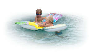 two cut out kids having fun in the pool