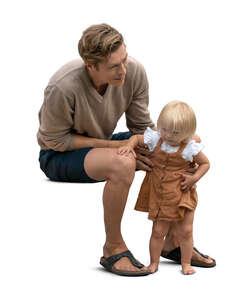 cut out man sitting and holding his baby daughter