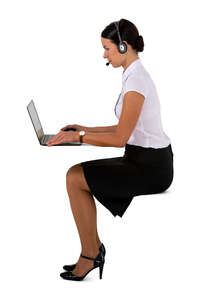 cut out businesswoman with a headset sitting at a desk