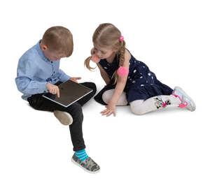 two cut out kids sitting and playing with a tablet