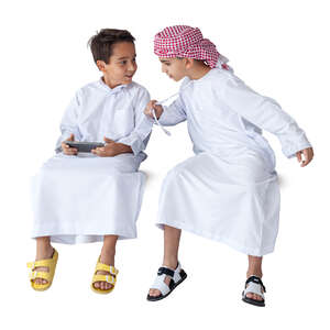 two cut out arab boys with phone sitting and smiling