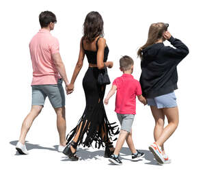 cut out family of four walking in the sunlight