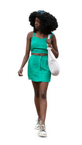 cut out woman in a green summer dress walking