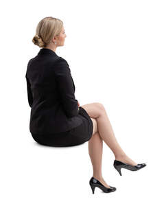 cut out woman in a black classical business suit sitting