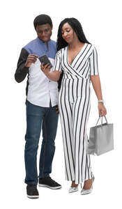 two cut out black people standing and looking at a phone