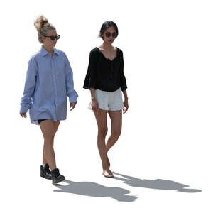 two cut out backlit women walking