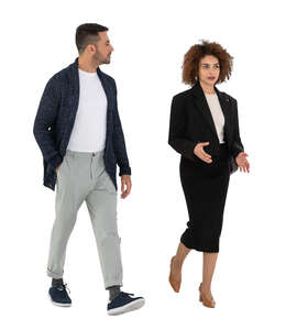 two cut out people walking and talking