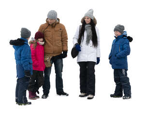 cut out family with three kids  standing together in winter
