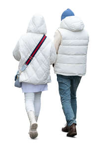 two cut out people in white winter jackets walking