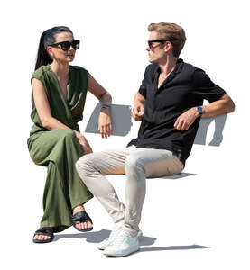 cut out man and woman sitting outside and talking