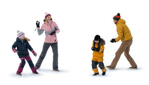 cut out family having a snowball fight in winter