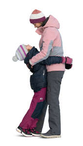 cut out mother and daughter in winter clothes hugging